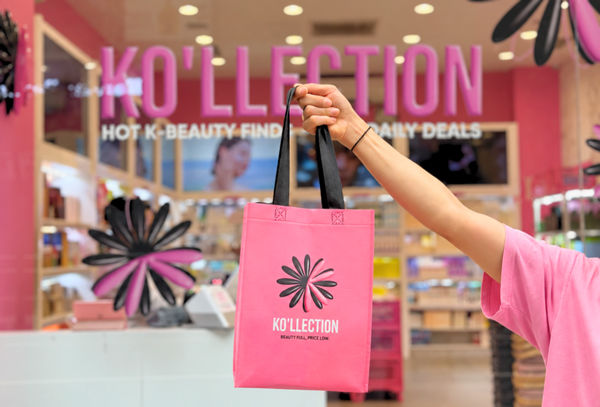 GLOW RICH neon sign inside Ko'llection store