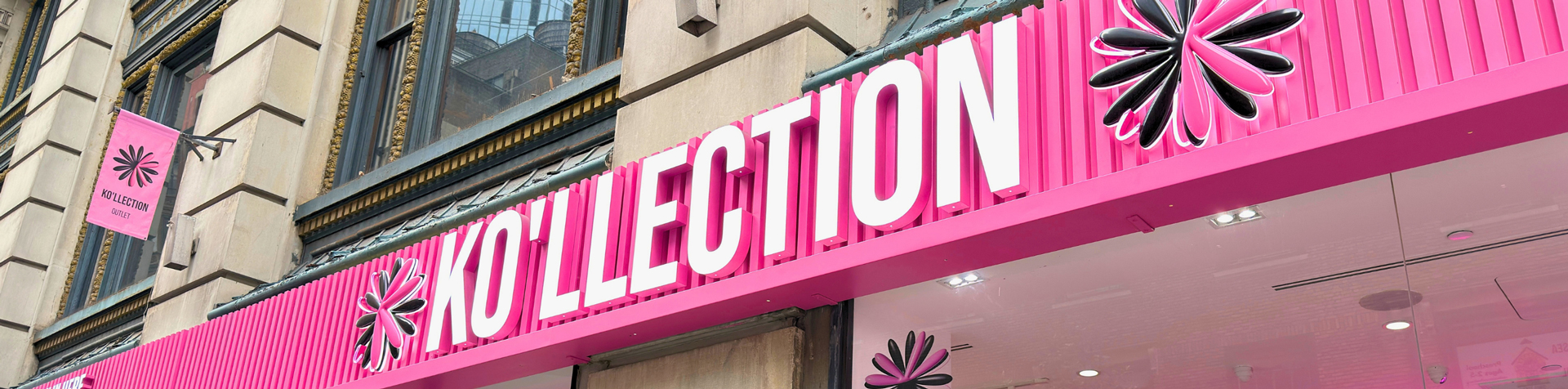 Inside Ko'llection — shelves of K-beauty products in the pink-themed store